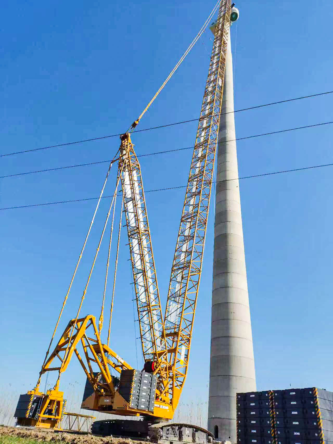 160米高空精准“搭积木”：J9集团XLC15000M分体吊装6.25兆瓦风机全纪录